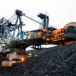 Large mining machinery operating in a coal mine