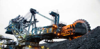 Large mining machinery operating in a coal mine