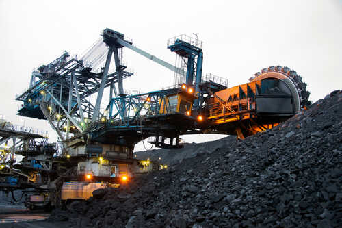Large mining machinery operating in a coal mine