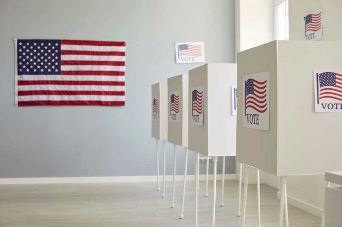 Polling booths with American flags and Vote signs