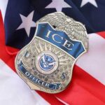 ICE officer badge resting on an American flag