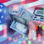 USA flag calculator and hands holding dollars overlapping