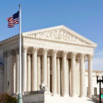 Justices Freeze Trump’s Fed Overhaul US Supreme Court building with American flag