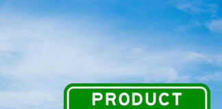 Green sign with product recall text and sky background