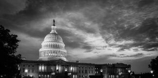 U.S. Capitol building at dusk, black and white photograph.