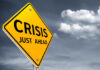 A yellow warning sign indicating a crisis ahead