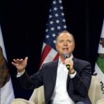 Schiff’s Explosive Trump Accusation A speaker addressing an audience with California flags in the background