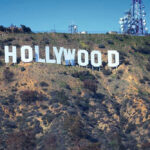 LEGENDARY Actor DIES — Hollywood Icon GONE! Hollywood sign on hillside with communication towers.