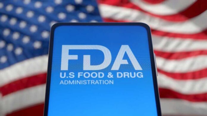 FDA logo displayed on a smartphone with an American flag background