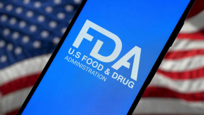 FDA logo on smartphone American flag background