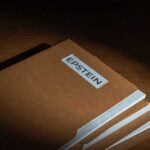 Stack of brown file folders with a label reading 'EPSTEIN'