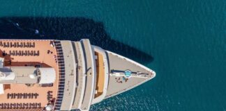 Aerial view of a cruise ship's deck with sun loungers and a pool