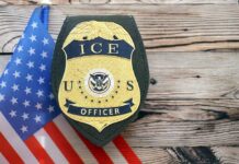 ICE officer badge displayed next to the U.S. flag