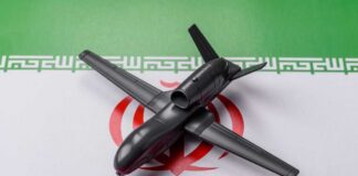 A model drone placed on the Iranian flag