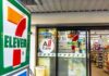 Exterior view of a 7-Eleven convenience store with All Cafe signage