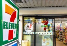 Exterior view of a 7-Eleven convenience store with All Cafe signage
