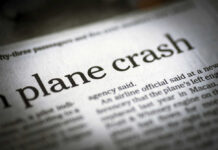 Troop Plane CRASHES — 29 Killed Newspaper headline about a plane crash.