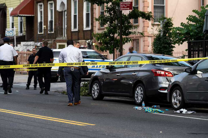1437619232 Police and crime scene tape on city street.