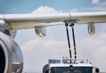 THIS Name Triggers Midair PANIC Close-up of an airplane wing being fueled by a ground support truck