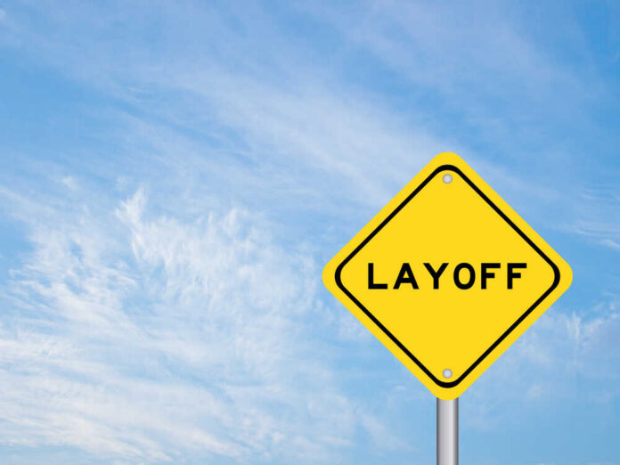 Yellow,Color,Transportation,Sign,With,Word,Layoff,On,Blue,Sky Yellow warning sign displaying the word 'LAYOFF'