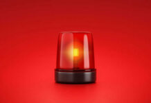 Trapped For Days — Only Her Face Showed Red emergency light on red background