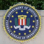 FBI seal featuring stars and laurel leaves