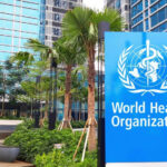 Ebola Spike Or Ominous Math? World Health Organization sign outside modern building
