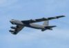 B-52 bomber flying against a blue sky