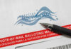 Trump Seeks Supreme Control Over Mail Ballots Vote-by-mail envelope with pen on top.