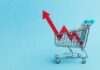 Grocery Bills Surge, Carts Shrink A shopping cart with red arrows indicating growth on a blue background