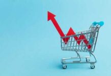 Grocery Bills Surge, Carts Shrink A shopping cart with red arrows indicating growth on a blue background