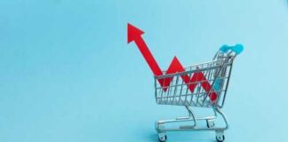 A shopping cart with red arrows indicating growth on a blue background
