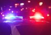 Florida Car, One Shot, Lifelong Fallout Police car with flashing red and blue lights at night