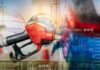 Gas Shock: War Hits Pumps at Home – AGAIN! Gas pump with financial data overlay and oil refinery in the background