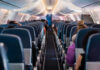 Mystery Fumes Hit Airline Crew Mid-Flight Airplane interior with passengers seated mid-flight.