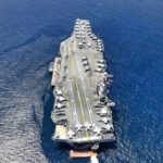 1,000 Missiles Ready — Guess Who’s Targeted Aircraft carrier on open sea with parked planes