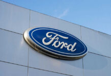 Mustangs Lose Power — Water Did This? Ford logo on a buildings exterior wall