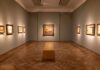 Museum Alarms Fail, Thieves Vanish Interior of an art gallery with paintings on the walls and a wooden bench in the center