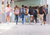 Pepper-Spray Drones Now Patrol School Halls? Children running with backpacks outside a school building.