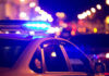 VIDEO: Officer Killed As Domestic Call Becomes Deadly Firefight Police car with flashing blue lights at night.