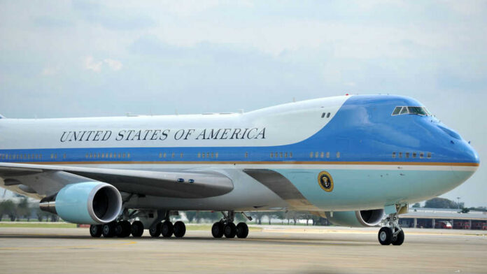 shutterstock_1699081159 Airplane labeled United States of America on runway
