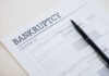 Delinquencies Spike To 15-Year High Bankruptcy Chapter 13 form with a pen resting on it