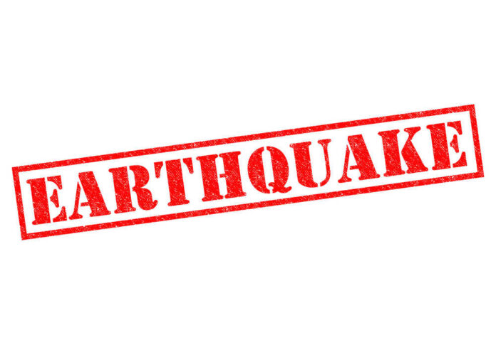 Earthquake,Red,Rubber,Stamp,Over,A,White,Background. Red stamp with the word EARTHQUAKE