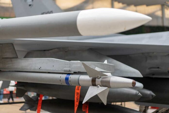 Airplane,Missile,Launcher,Close,Up.,War,Concept. Missiles silhouetted against American flag background with sunset.
