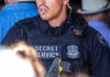 Secret Service Shock: Comms Boss Benched Secret Service officer in uniform with equipment visible.