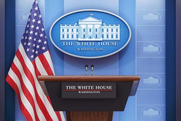 White House press briefing podium with microphones and U.S. flag