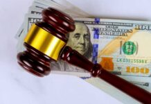 Green Bank Showdown Shocks Washington Judge’s gavel on a stack of U.S. hundred-dollar bills