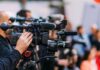 Video cameras on tripods at a media event