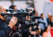 Tainted Sprouts Spark Multistate Scare Video cameras on tripods at a media event