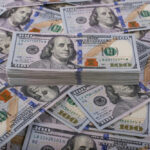 Overhaul Bleeding Billions But More Needed Stack of one hundred dollar bills, Benjamin Franklins portrait.